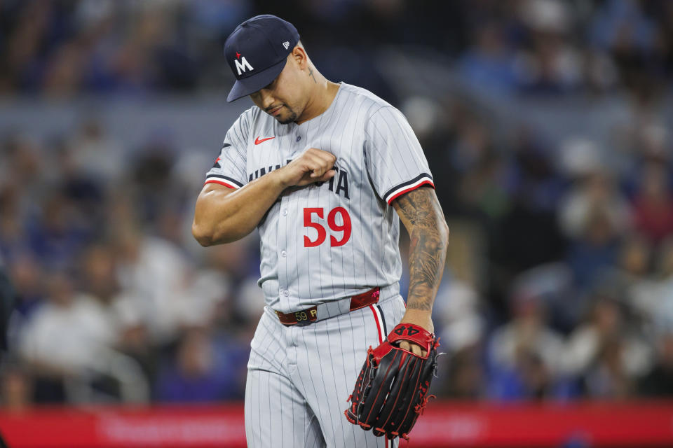 Minnesota Twins pitcher Jhoan Duran reacts after the eighth inning of the team's baseball game against the Toronto Blue Jays on Friday, May 10, 2024, in Toronto. (Cole Burtson/The Canadian Press via AP)