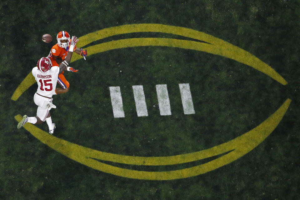 FILE - Alabama's Ronnie Harrison (15) breaks up a pass intended for Clemson's Artavis Scott during the second half of the NCAA college football playoff championship game in Glendale, Ariz., in this Monday, Jan. 11, 2016, file photo. The College Football Playoff would expand from four to 12 teams, with six spots reserved for the highest ranked conference champions, under a proposal that will be considered next week by the league commissioners who manage the postseason system, a person familiar with announcement told The Associated Press on Thursday, June 10, 2021. The person spoke on condition of anonymity because the CFP has not yet released details. (AP Photo/Ross D. Franklin, File)