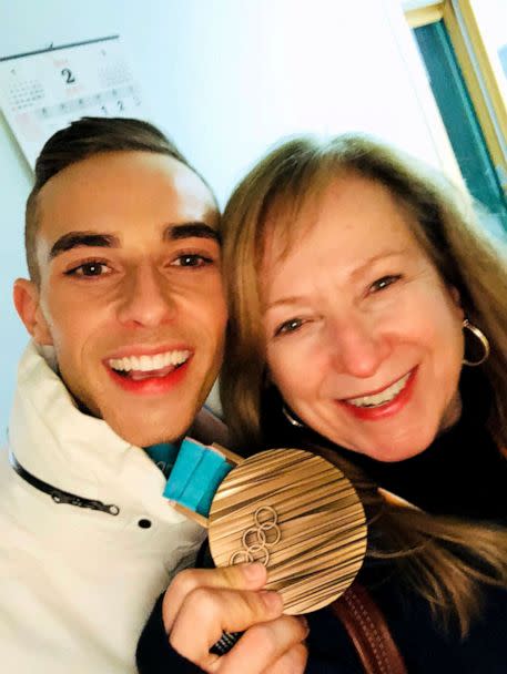 PHOTO: Adam Rippon and his mother, Kelly Rippon, pose with the bronze medal he won at the 2018 Winter Olympics in Pyeongchang, South Korea, in the figure skating team event. (Courtesy of Kelly Rippon)