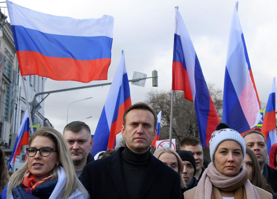 Alexei Navalny, his wife Yulia, opposition politician Lyubov Sobol and other demonstrators take part in a march in memory of murdered Kremlin critic Boris Nemtsov in downtown Moscow on February 29, 2020. Source: Getty