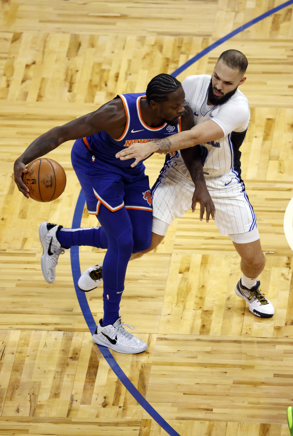 Feb 17, 2021; Orlando, Florida, USA; New York Knicks forward Julius Randle (30) moves to the basket as Orlando Magic guard Evan Fournier (10) defends during the first quarter at Amway Center. Mandatory Credit: Kim Klement-USA TODAY Sports