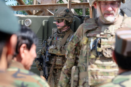 A soldier with the British army's Royal Irish Regiment provides security for a meeting between international military advisers and Afghan officials at a base in Kabul, Afghanistan July 12, 2017. REUTERS/Josh Smith