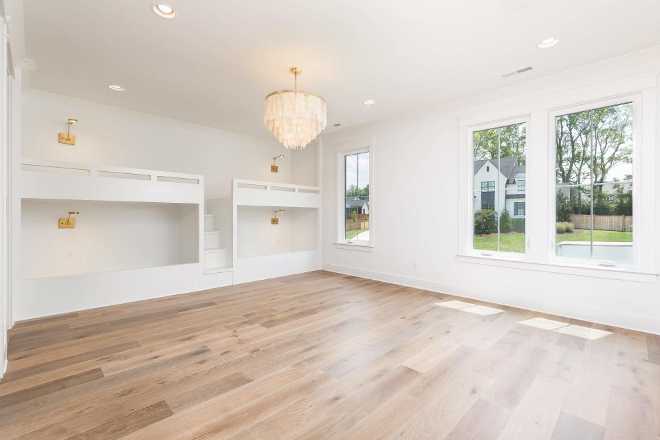 A transitional farmhouse built by Carbine & Associates in Franklin includes an upstairs bonus area with built-in bunk beds and plenty of flex space.