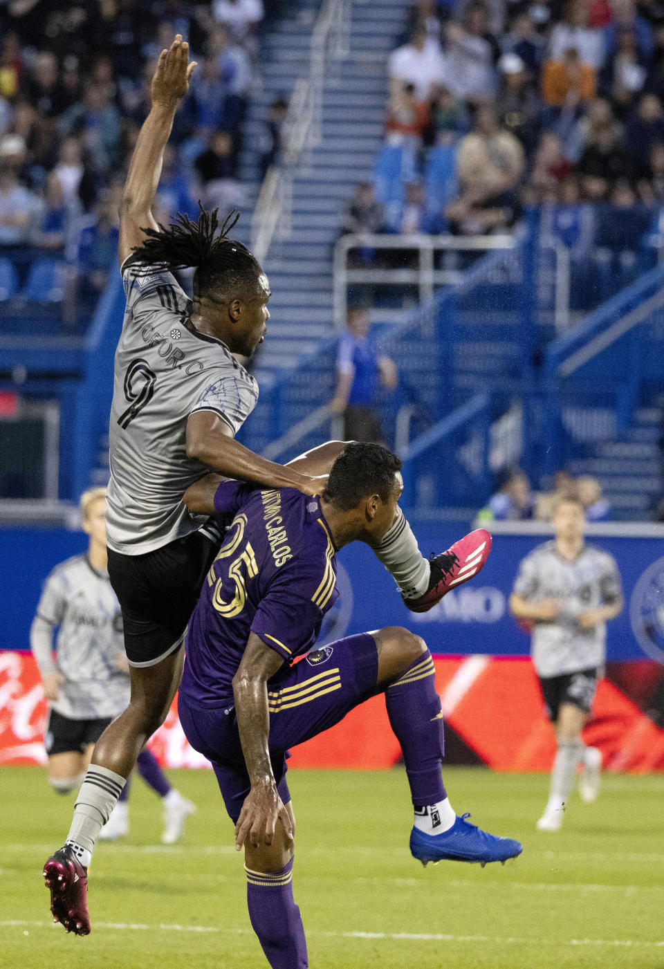CF Montreal forward Chinonso Offor, left, and Orlando City defender Antonio Carlos collide after heading the ball during the first half of an MLS soccer game in Montreal, Saturday, May 6, 2023. (Allen McInnis/The Canadian Press via AP)