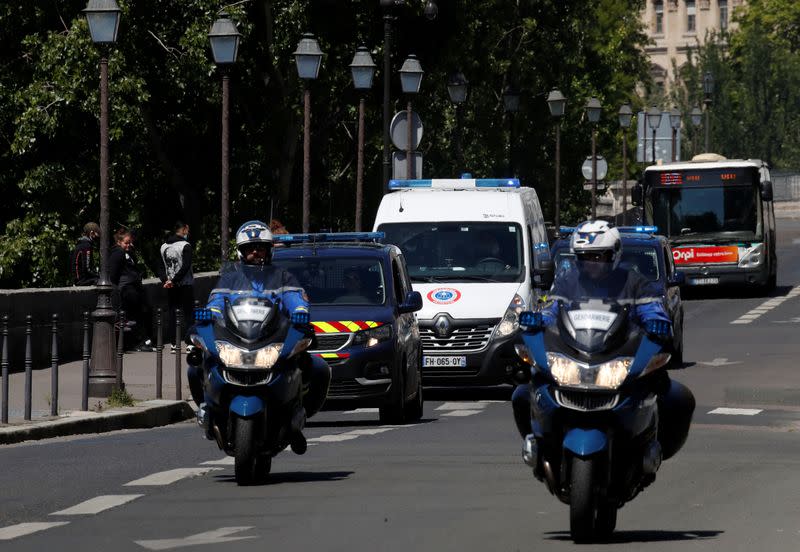A police convoy believed to be carrying Rwandan genocide fugitive Felicien Kabuga arrives at the Paris courthouse
