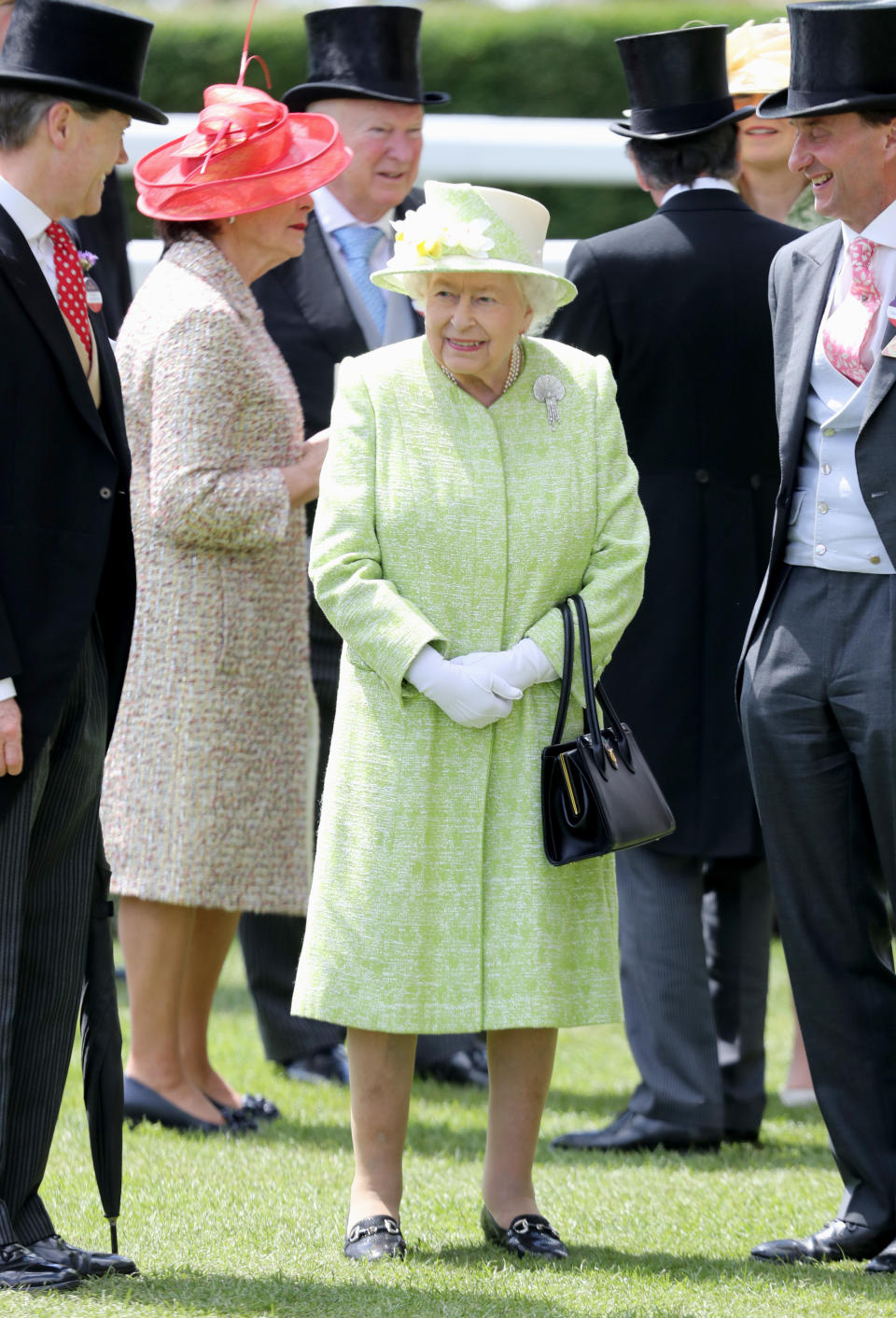 The Queen chose a muted lime coat with a matching floral hat for the final day of Royal Ascot. <em>[Photo: Getty]</em>