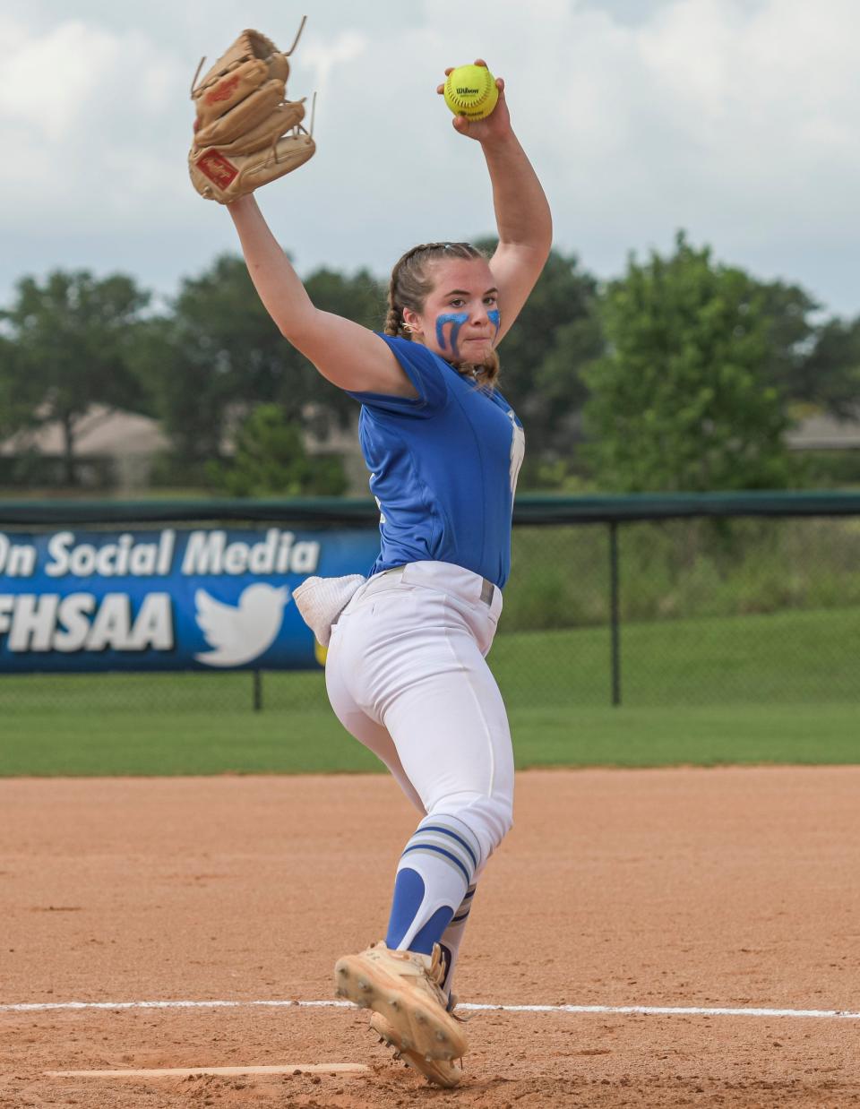 Deltona's Katie McCaw (8) warms up between innings at the Class 5A state championship game at Legends Way Ball Fields in Clermont on Thursday.