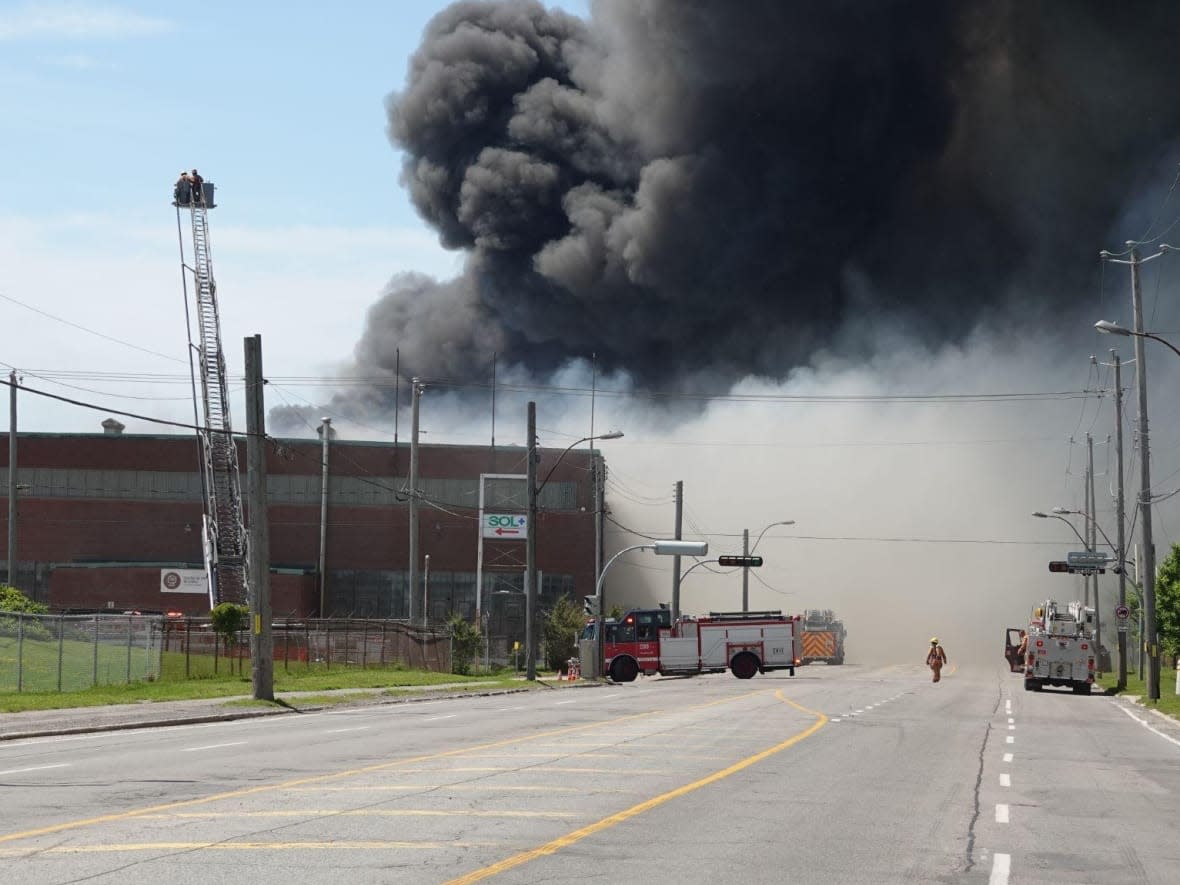 A few of the 140 firefighters on-site had to be treated for heat exhaustion.  (Mathieu Wagner/Radio-Canada - image credit)