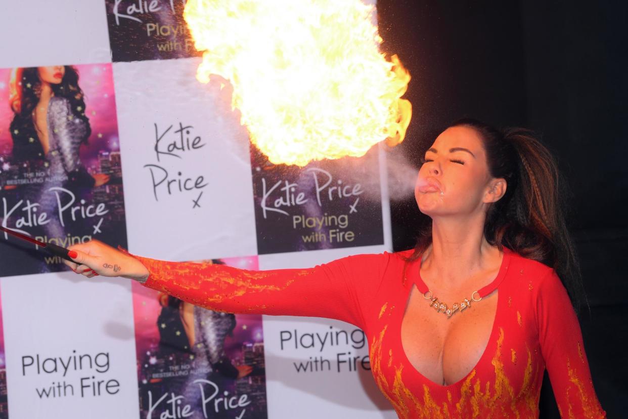 Multi-talented: Katie Price breathing fire: Rex Features