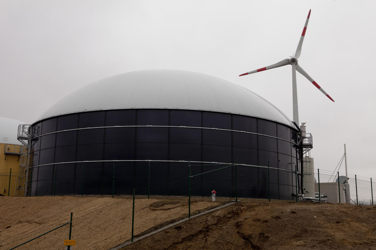 A biomass silo and a wind turbine