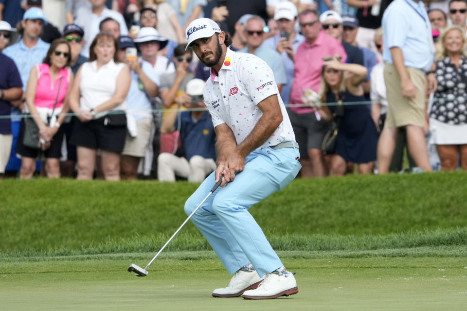 Max Homa reacts as he misses a birdie-attempt on the 18th green during the second round of the BMW Championship golf tournament, Friday, Aug. 18, 2023, in Olympia Fields, Ill. (AP Photo/Charles Rex Arbogast)