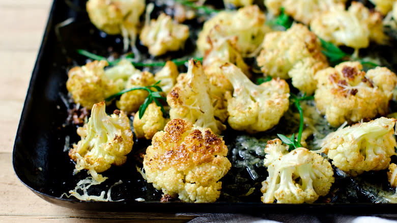 roasted cauliflower on black tray