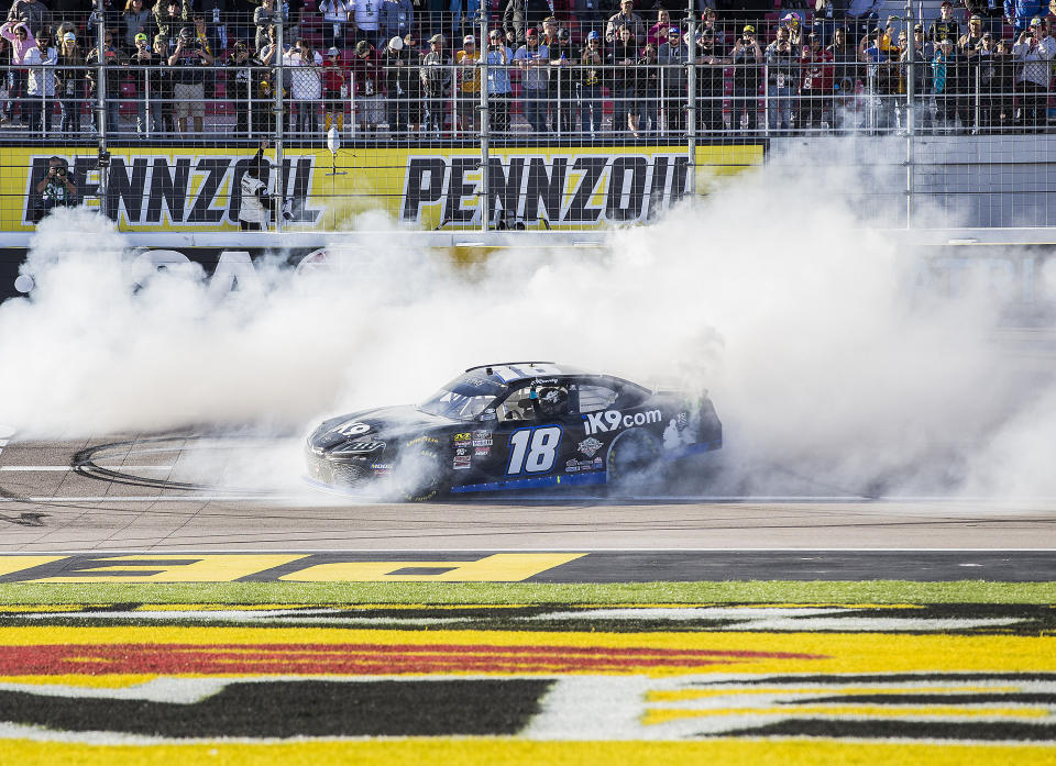 Kyle Busch celebrates with a burnout after winning the NASCAR Xfinity Series auto race Saturday, March 2, 2019, at Las Vegas Motor Speedway in Las Vegas. (Benjamin Hager/Las Vegas Review-Journal via AP)