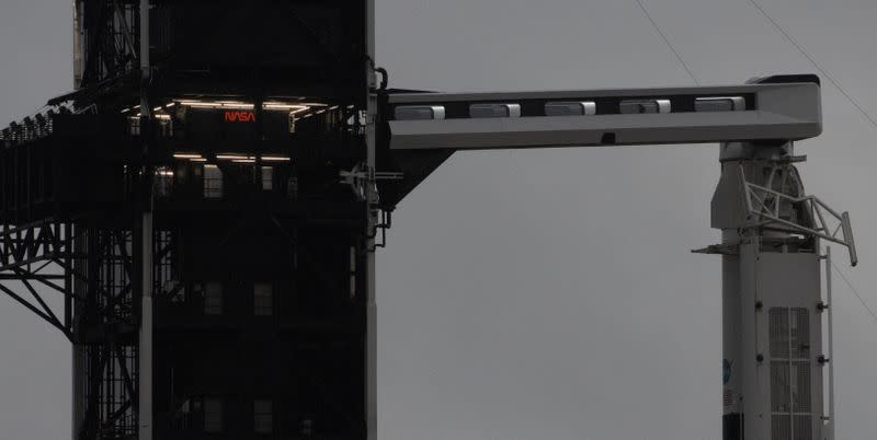 SpaceX Falcon 9 rocket with the company's Crew Dragon spacecraft onboard rests on the launch pad