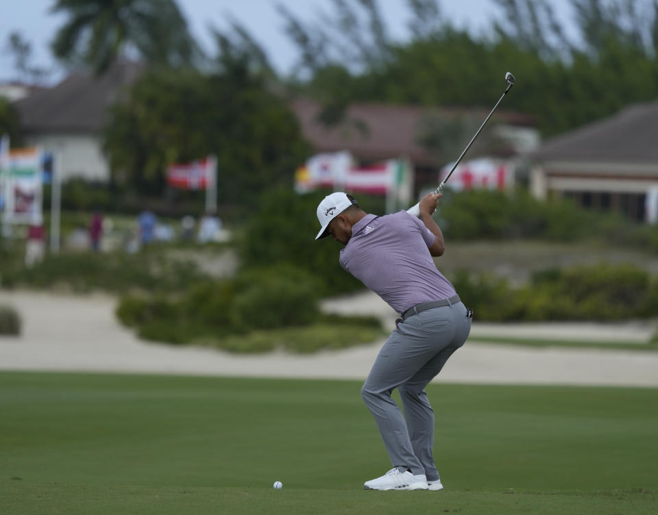 Xander Schauffele, of the United States, swings on the first fairway during the second round of the Hero World Challenge PGA Tour at the Albany Golf Club, in New Providence, Bahamas, Friday, Dec. 2, 2022. (AP Photo/Fernando Llano)