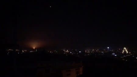 What is believed to be guided missiles are seen in the sky during what is reported to be an attack in Damascus, Syria, January 21, 2019, in this still image taken from a video obtained from social media. Facebook Diary of a Mortar Shell in Damascus/Youmiyat Qadifat Hawun fi Damashq/via REUTERS