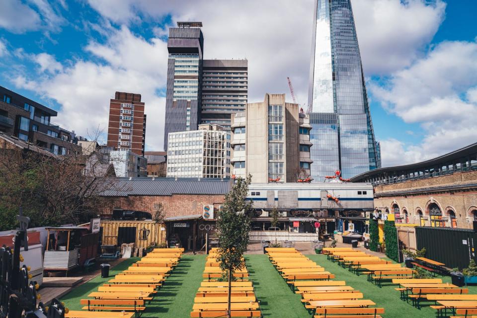 <p>This vast outdoor space of <a href="https://www.vinegaryard.london/" rel="nofollow noopener" target="_blank" data-ylk="slk:Vinegar Yard;elm:context_link;itc:0;sec:content-canvas" class="link ">Vinegar Yard</a> has canopy covers for the rain so that you can enjoy street food from vendors like Baba G's and Nanny Bill's whatever the weather.</p>