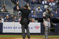 Umpire Andy Fletcher, left, calls a ball after San Francisco Giants' Taylor Rogers (not shown) took too long to throw a pitch in the eighth inning of a baseball game against the New York Yankees, Saturday, April 1, 2023, in New York. (AP Photo/Mary Altaffer)