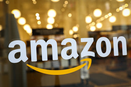 FILE PHOTO: The logo of Amazon is seen on the door of an Amazon Books retail store in New York City, U.S., February 14, 2019. REUTERS/Brendan McDermid