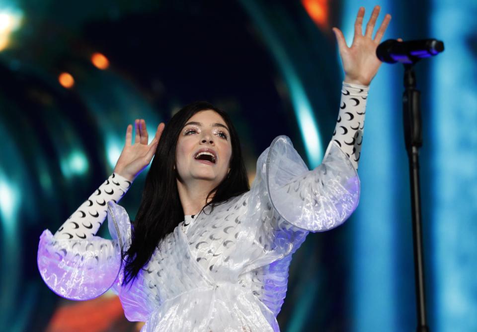 A closeup of Lorde performing