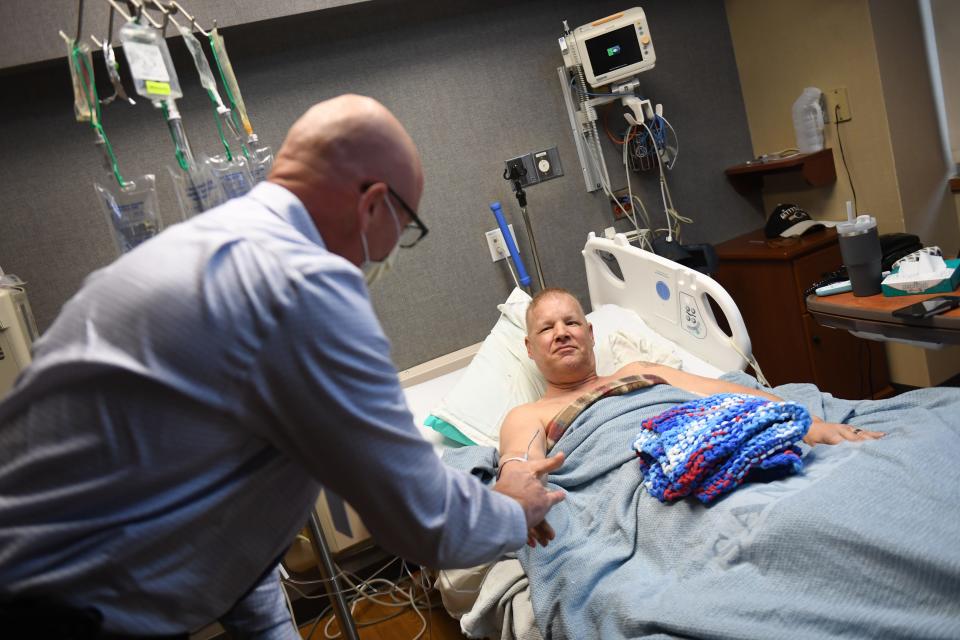 Robert Sommer (left) thanks Jeff Jones for his 20 years of service in the U.S. Army on Friday, Nov. 10, 2023 at Sanford USD Medical Center in Sioux Falls, South Dakota.