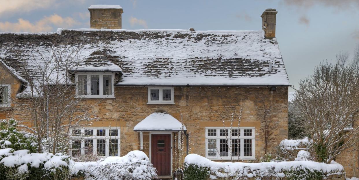 pretty cotswold cottage in snow, broadway, worcestershire, england