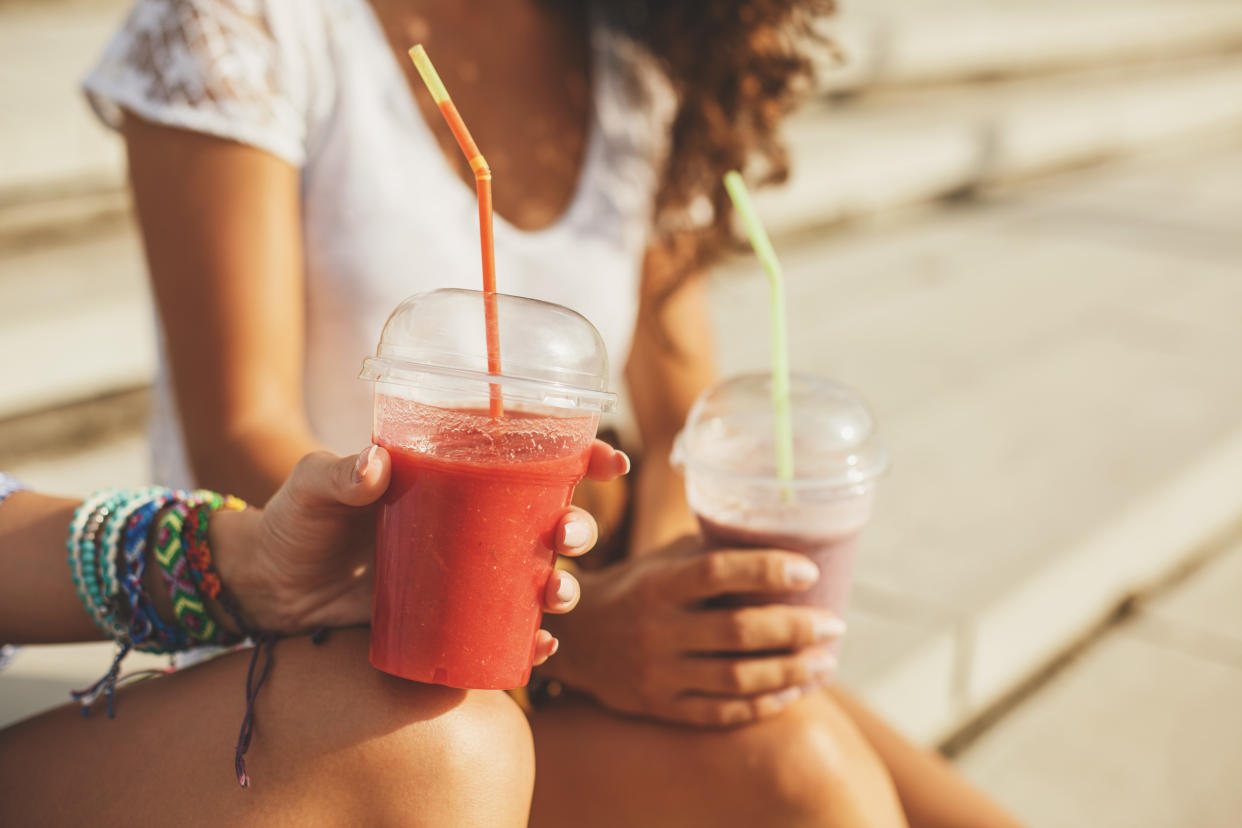 Women with smoothies. (Getty Images)