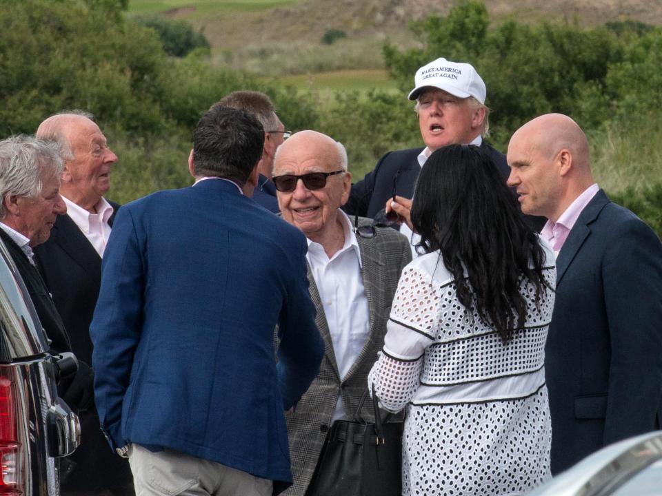 Donald Trump with Rupert Murdoch at one of his golf courses near Aberdeen, Scotland in 2016.