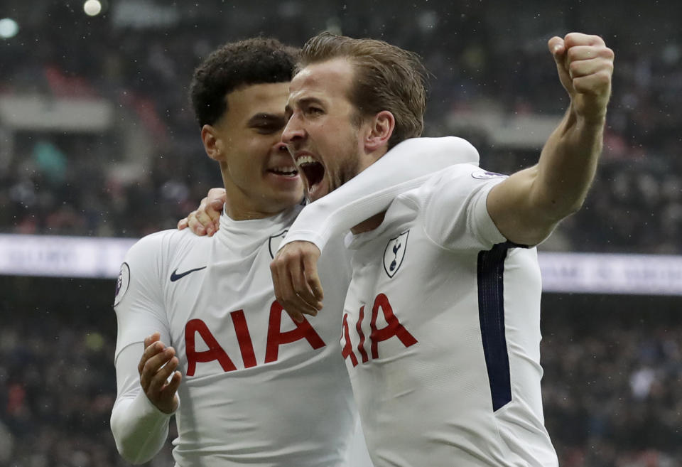 Harry Kane right, celebrates with Dele Alli after making it 1-0 to Tottenham
