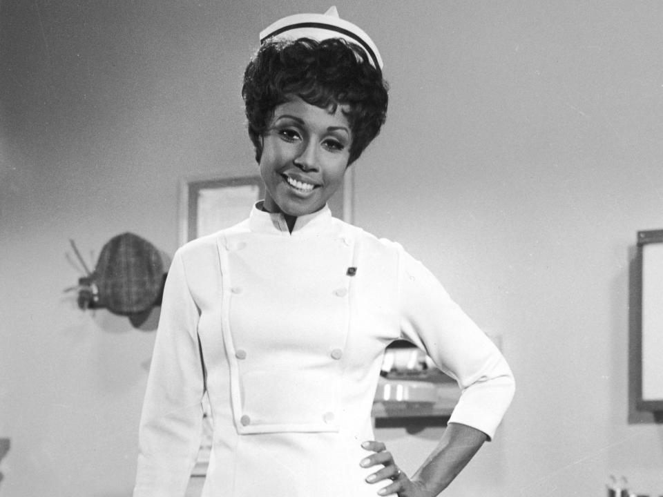 Black and white photo of Diahann in a nurses costume/uniform.