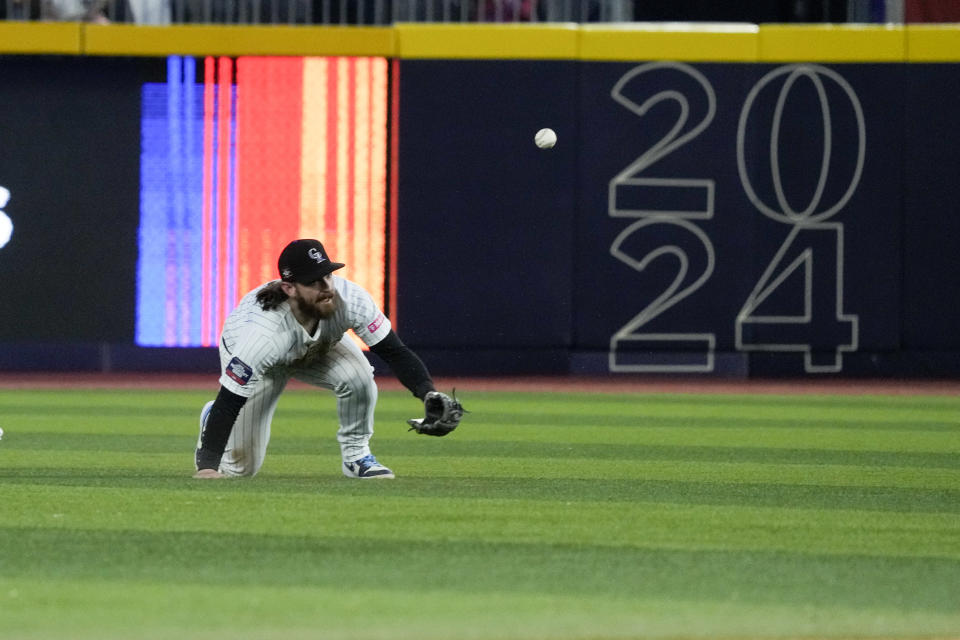 Colorado Rockies Brendan Rodgers fails to make the catch on a flyout ball by Houston Astros Chas McCormick during a baseball game at Alfredo Harp Helu stadium in Mexico City, Saturday, April 27, 2024. (AP Photo/Fernando Llano)