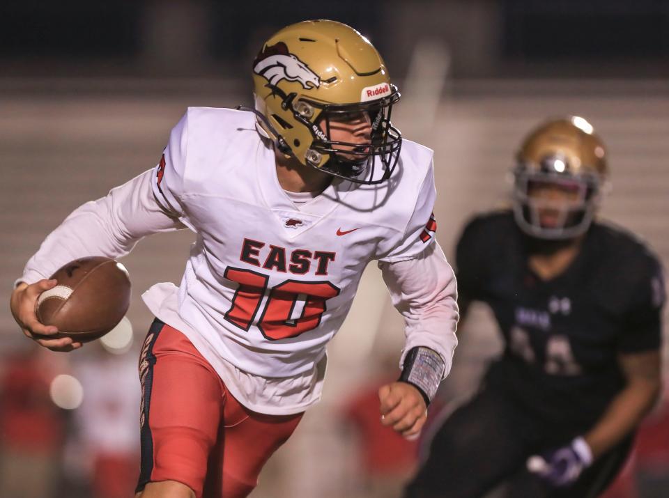 Bullitt East's Travis Egan runs for yardage in second half against Male Friday. Oct. 22, 2021