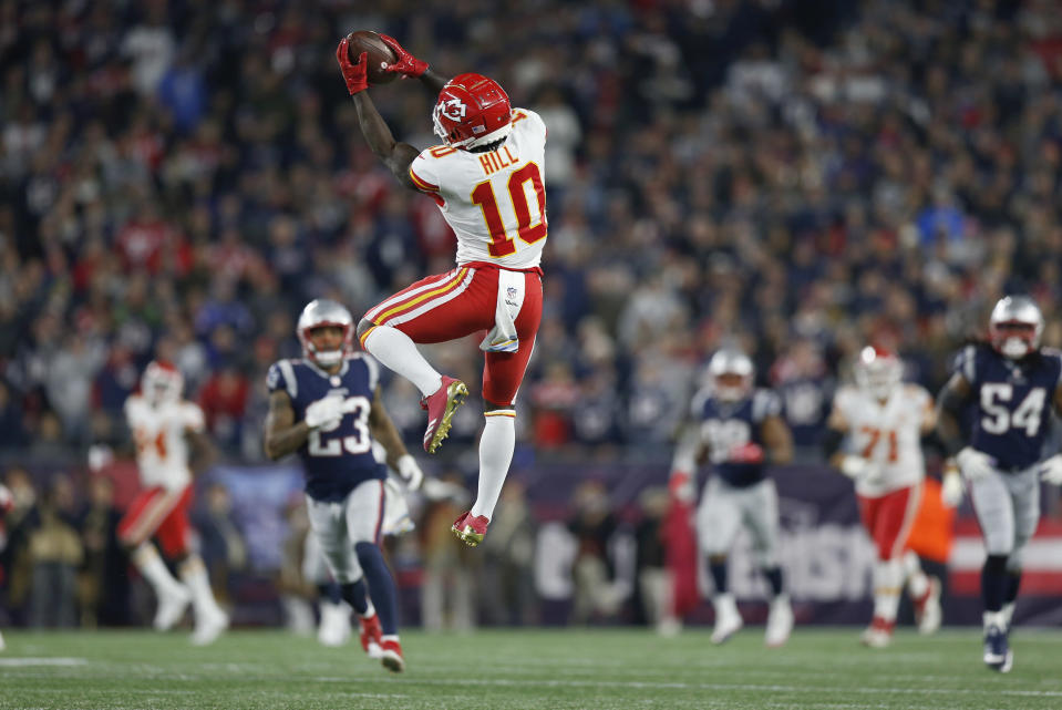 Kansas City Chiefs wide receiver Tyreek Hill (10) catches a pass that he ran in for a touchdown during the second half of an NFL football game against the New England Patriots, Sunday, Oct. 14, 2018, in Foxborough, Mass. (AP Photo/Michael Dwyer)