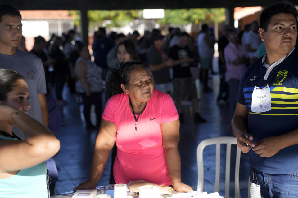 A woman waits her turn to vote during general elections in Asuncion, Paraguay, Sunday, April 30, 2023. (AP Photo/Jorge Saenz)