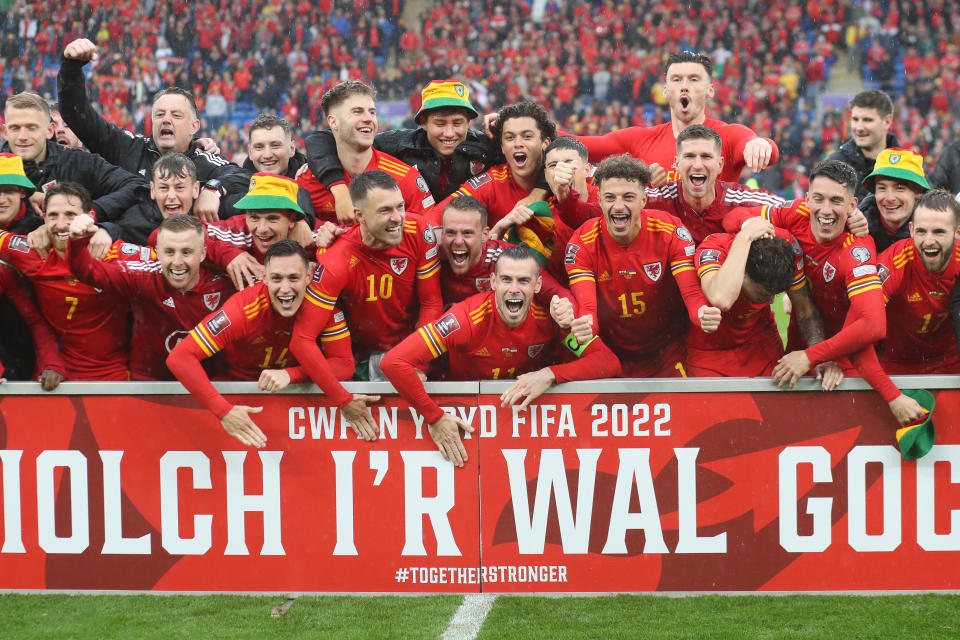 Pictured centre, Gareth Bale of Wales and his teammates celebrate after qualifying for the 2022 FIFA World Cup in Qatar.