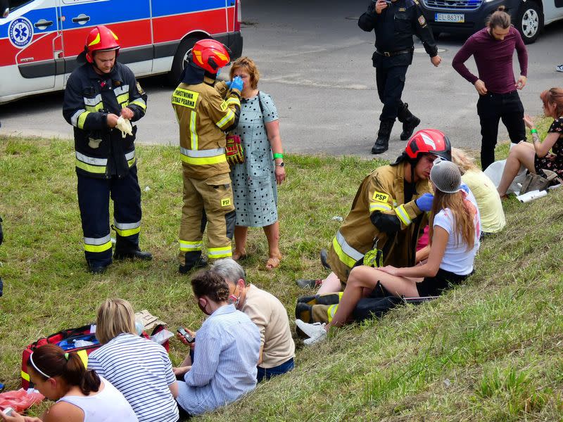 First responders attend to the scene of a public bus crash in Warsaw