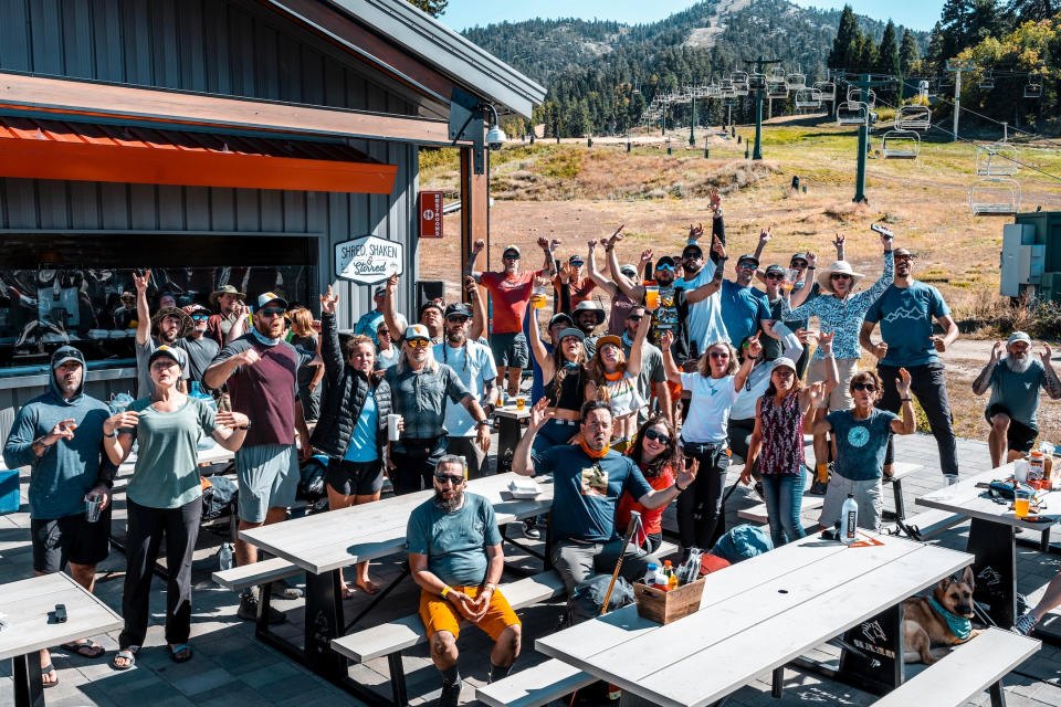 Hikers at the base of a ski resort in summer