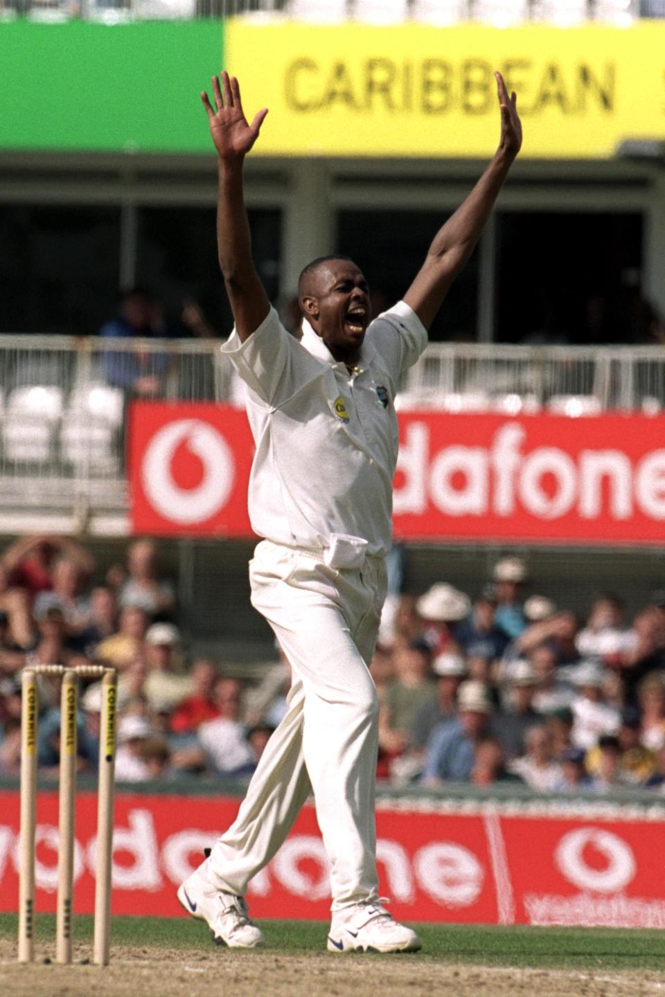 <p>Courtney Walsh celebrates another victim – this time England’s Michael Vaughan </p>