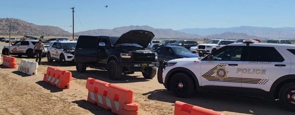 Sheriff’s deputies near the Apple Valley Airshow were seen surrounding a black vehicle and seizing illegal tactical gear. A Hesperia man was arrested.