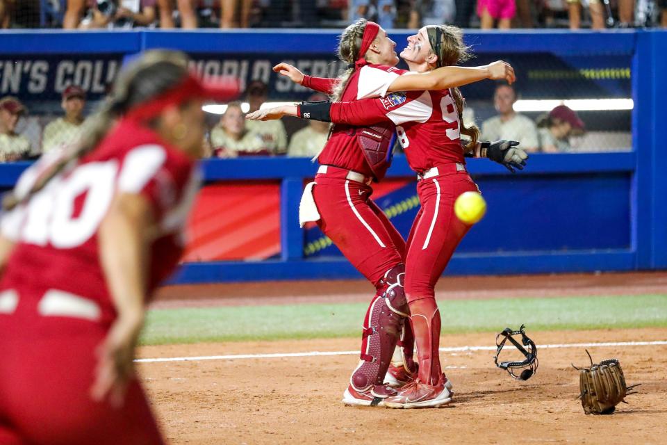 Oklahoma pitcher Jordy Bahl (98) and Oklahoma catcher Kinzie Hansen (9) celebrate after OU won the Women's College World Series finals between Oklahoma (OU) and Florida State at USA Softball Hall of Fame Stadium in Oklahoma City on Thursday, June 8, 2023.