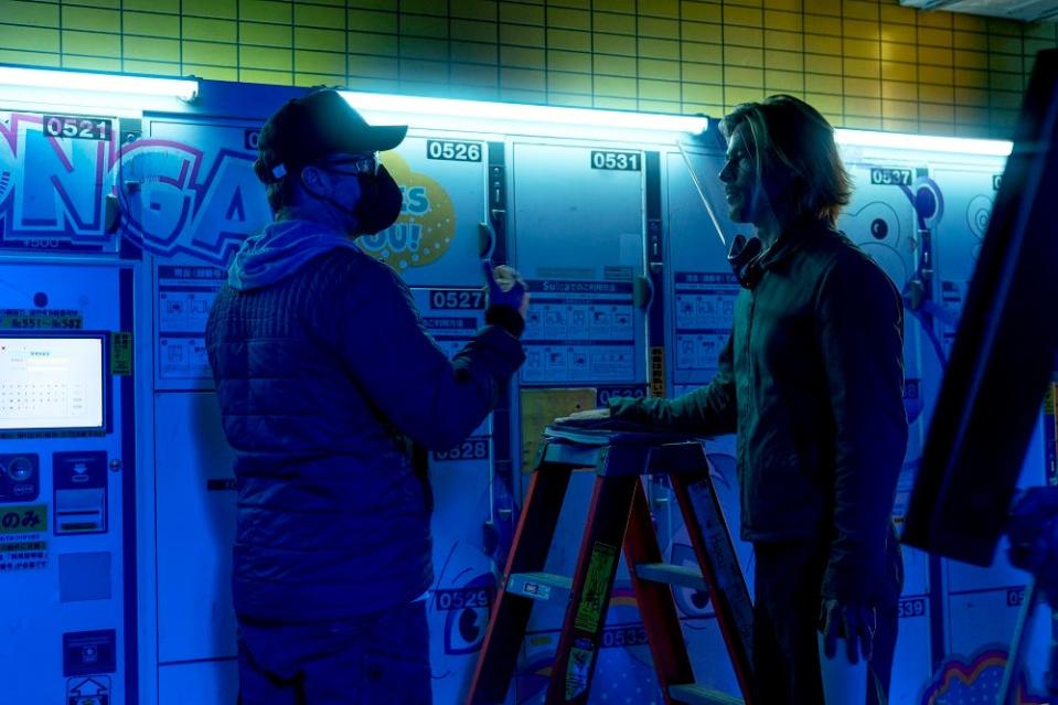 Director David Leitch and Brad Pitt set up a scene in "Bullet Train."