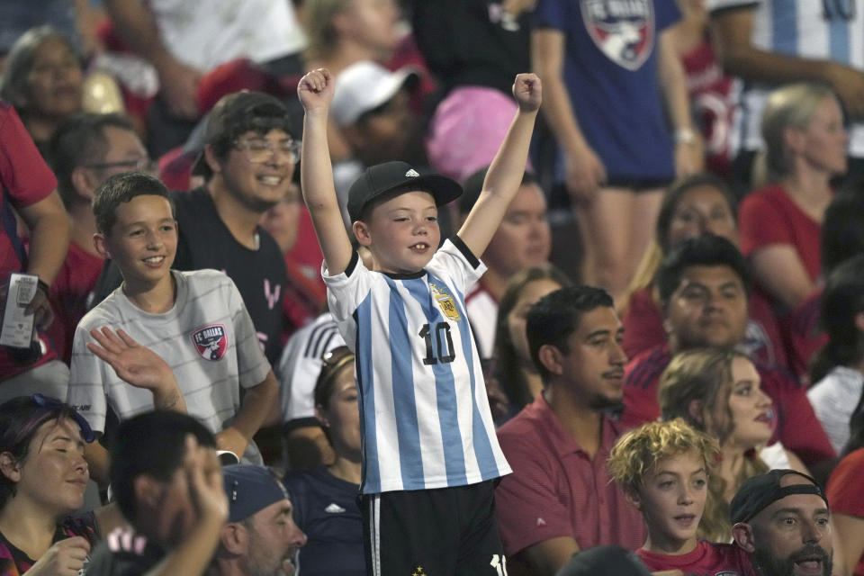 A young fan cheers during the first half of a Leagues Cup soccer match between Inter Miami and FC Dallas, Sunday, Aug. 6, 2023, in Frisco, Texas. (AP Photo/LM Otero)