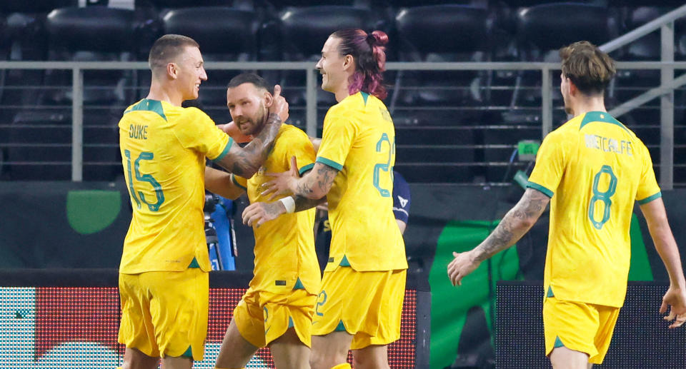 Second from left is Martin Boyle celebrating with Socceroos teammates after scoring a penalty against Mexico. 