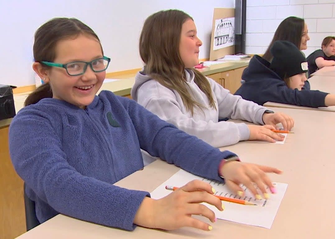 Grade 4 students Nova Coutu and Aubree Boudreau say Michif French is one of their favourite classes, and they enjoy practising the language at home with relatives. (Travis Golby/CBC - image credit)