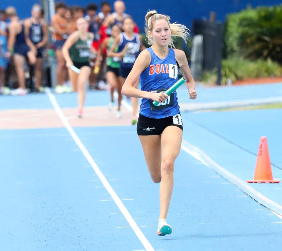 The Bolles 4x800 relay team leads the pack on the way to victory in the Class 2A girls track and field championship in May. Bolles finished atop the statewide rankings across all sports in 2021-22.