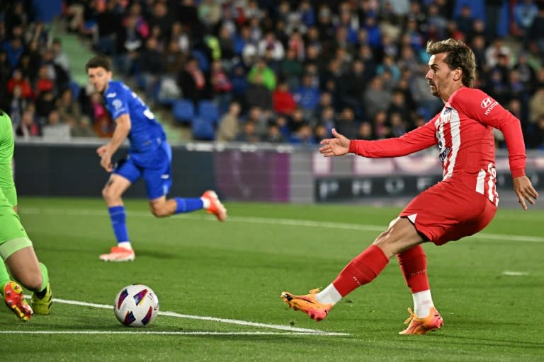 Atletico Madrid forward <a class="link " href="https://sports.yahoo.com/soccer/players/373176/" data-i13n="sec:content-canvas;subsec:anchor_text;elm:context_link" data-ylk="slk:Antoine Griezmann;sec:content-canvas;subsec:anchor_text;elm:context_link;itc:0">Antoine Griezmann</a> netted a hat-trick as his side thrashed <a class="link " href="https://sports.yahoo.com/soccer/teams/getafe/" data-i13n="sec:content-canvas;subsec:anchor_text;elm:context_link" data-ylk="slk:Getafe;sec:content-canvas;subsec:anchor_text;elm:context_link;itc:0">Getafe</a> to secure Champions League football (JAVIER SORIANO)