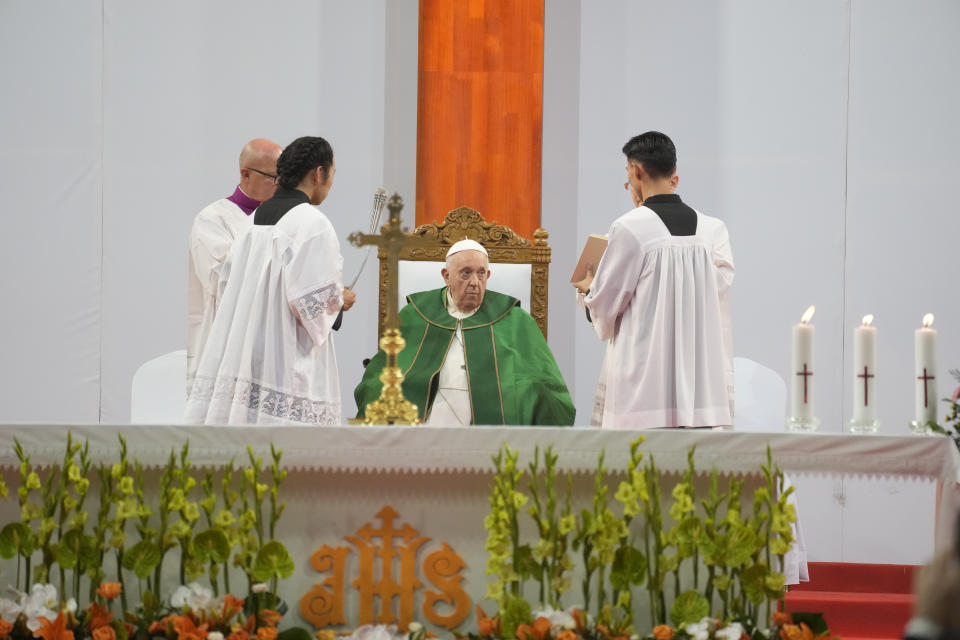 Pope Francis, center, presides over a mass at the Steppe Arena in the Mongolian capital Ulaanbaatar, Sunday, Sept. 3, 2023. Francis is in Mongolia to minister to one of the world's smallest and newest Catholic communities. Neighboring China's crackdown on religious minorities has been a constant backdrop to the trip, even as the Vatican hopes to focus attention instead on Mongolia and its 1,450 Catholics. (AP Photo/Andrew Medichini)