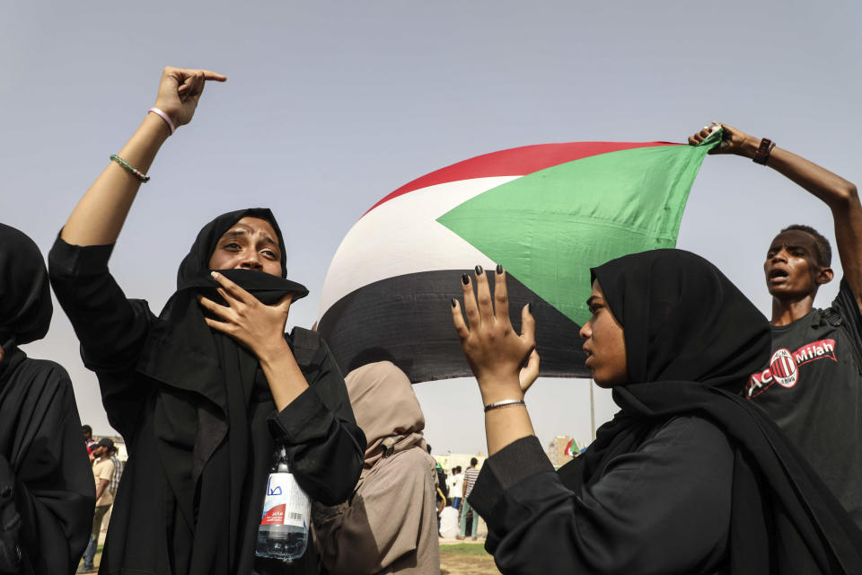 FILE - In this Thursday, July 18, 2019 file photo, people take part in a protest condemning a deadly crackdown the previous month in Khartoum, Sudan. In 2019 mass protests against the autocratic president, Omar al-Bashir, led to his ouster by the military. The country is now on a fragile path to democracy, ruled by a transitional government. (AP Photo/Mahmoud Hjaj, File)