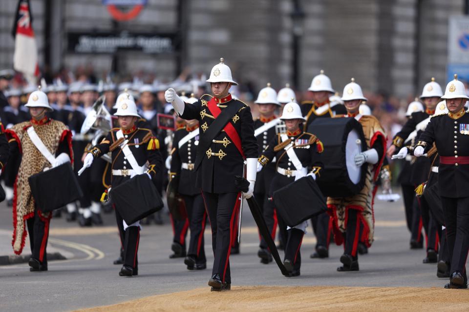 The Royal Marines Band Service are seen during the procession for the Lying-in State of Queen (via REUTERS)