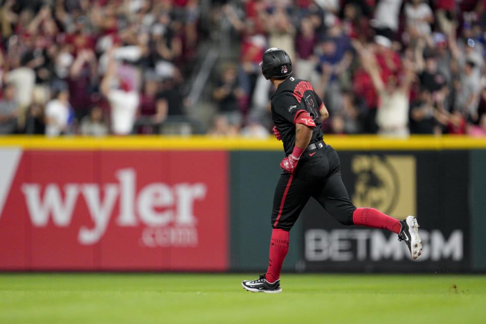 Cincinnati Reds' Christian Encarnacion-Strand watches his walkoff home run against the Toronto Blue Jays in the ninth inning of a baseball game in Cincinnati, Friday, Aug. 18, 2023. (AP Photo/Jeff Dean)